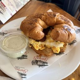 Susana's Cafe signature dishes Breakfast Croissant SandwichEmpanada Venezolana ChickenBreakfast Bagel Sandwich